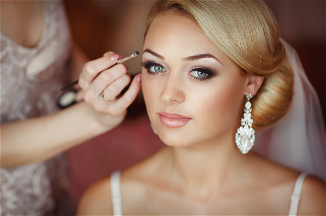 Bride having make up done